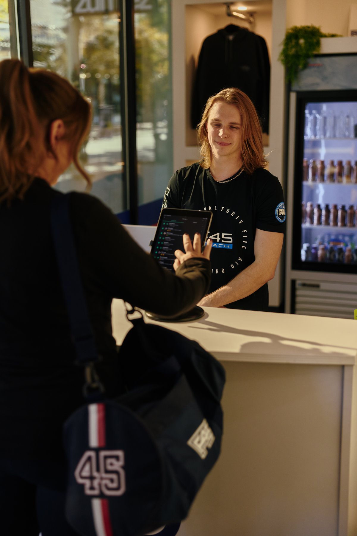 A member checking in at the front desk